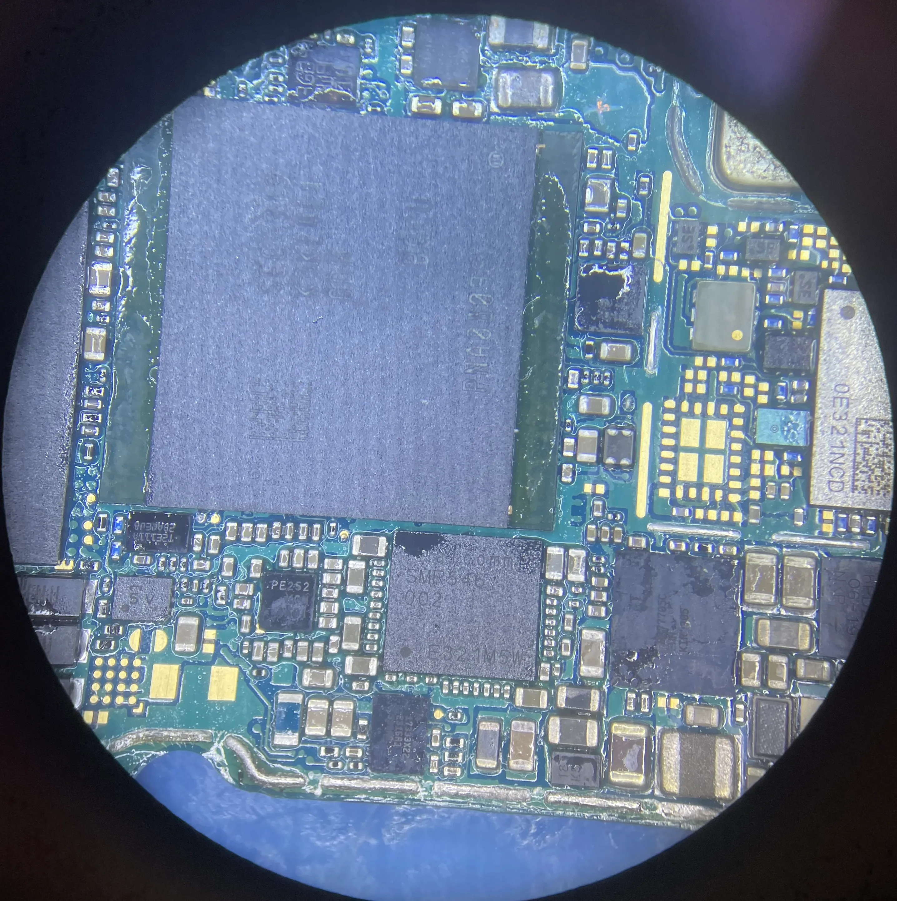 Electronic board components viewed through a microscope